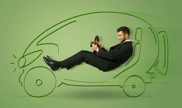 Homme conduit une voiture électrique dessinée à la main écologique — Photo