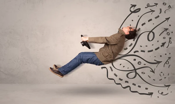 Funny man driving a flying vehicle with hand drawn lines after h — Stock Photo, Image