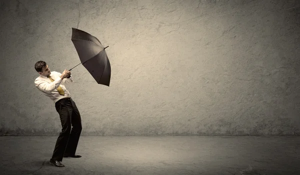 Handsome business man holding umbrella with copy space backgroun — Stock Photo, Image