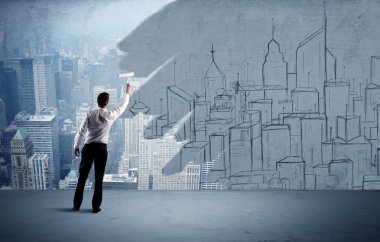 Zarif satıcı şehri duvarda yeniden boyuyor.