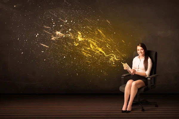 Businesswoman with tablet and energy explosion on background — Stock Photo, Image