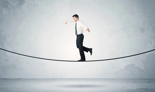 Sales guy balancing on tight rope — Stock Photo, Image