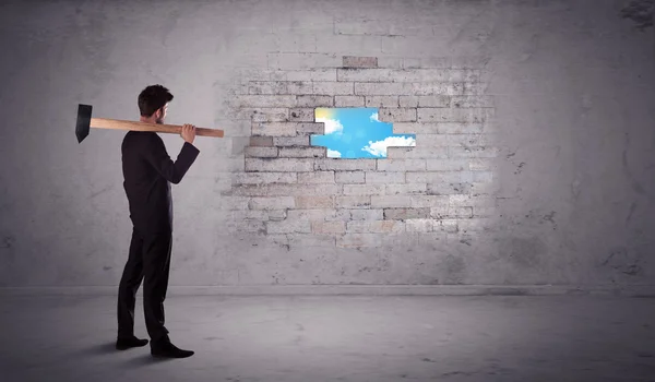 Business man hitting brick wall with hammer — Stock Photo, Image