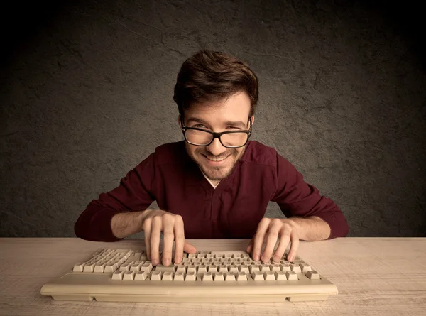 Computer geek typing on keyboard — Stock Photo, Image