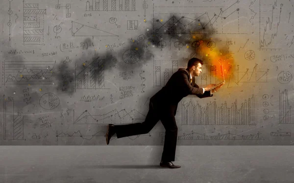 Running business man with fire laptop — Stock Photo, Image