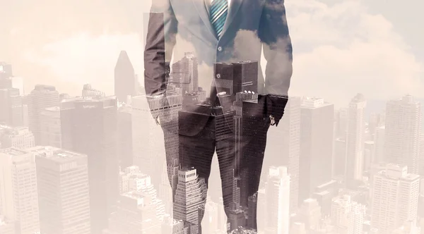 Handsome business man with overlay cityscape — Stock Photo, Image