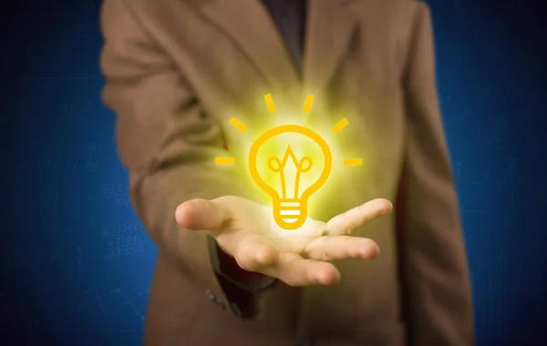 Sales guy has bright idea in the hand — Stock Photo, Image