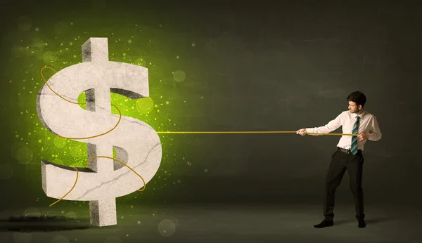 Business man pulling a big green dollar sign — Stock Photo, Image