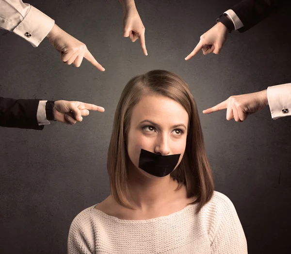 Multiple hands pointing at woman — Stock Photo, Image