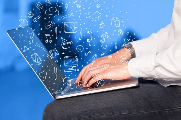 Laptop computer wtih hand drawn icons and symbols — Stock Photo, Image