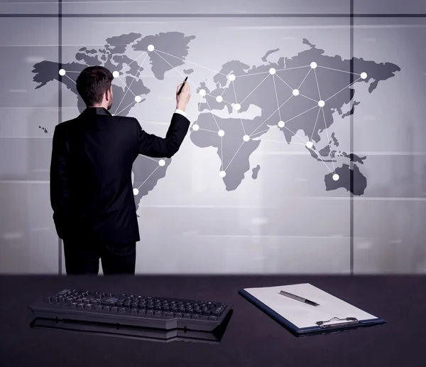 Business person drawing dots on world map — Stock Photo, Image