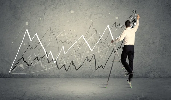 Man on ladder drawing lines — Stock Photo, Image