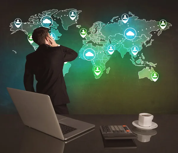 Salesman drawing on world map at office — Stock Photo, Image