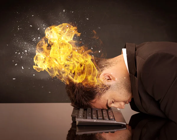 Stressed business man's head is burning — Stock Photo, Image