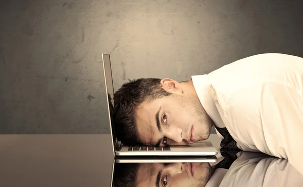 Frustrated businessman's head on keyboard — Stock Photo, Image