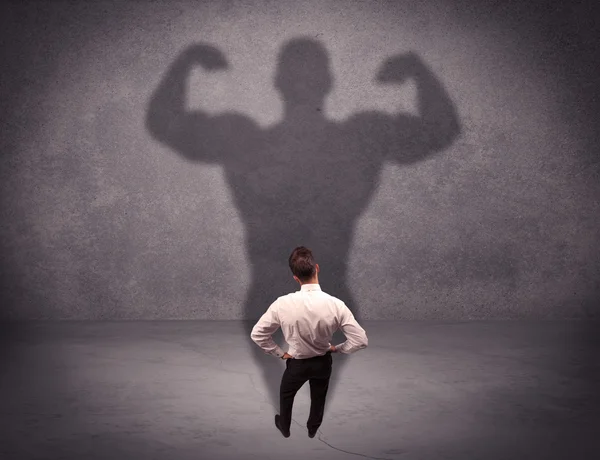 Successful businessman with strong shadow — Stock Photo, Image