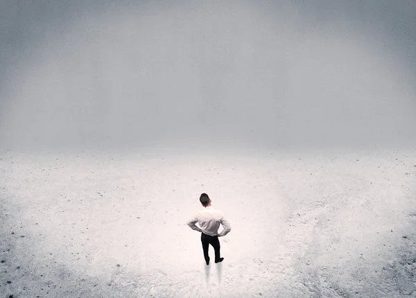 Businessman standing in urban empty space — Stock Photo, Image