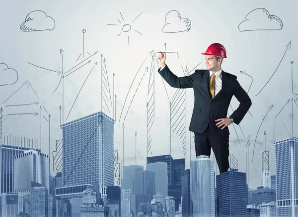 Young worker drawing a city sight — Stock Photo, Image