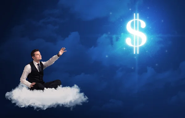 Man zit op een wolk dromen geld — Stockfoto