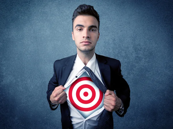 Businessman tearing shirt with target sign on his chest — Stock Photo, Image