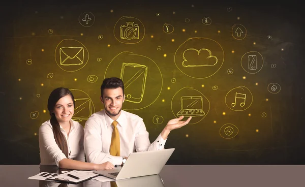 Business couple with media icons background — Stock Photo, Image