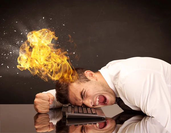 Stressed business man's head is burning — Stock Photo, Image