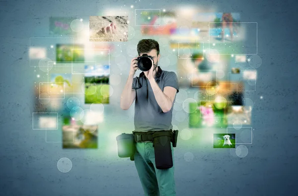 Photographer with pictures from the past — Stock Photo, Image