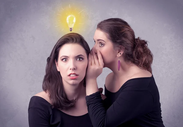 Girl telling secret things to her girlfriend — Stock Photo, Image