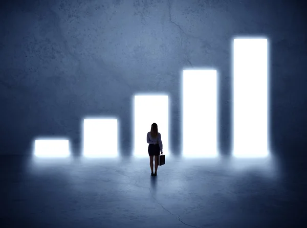 Woman standing in front of a chart — Stock Photo, Image