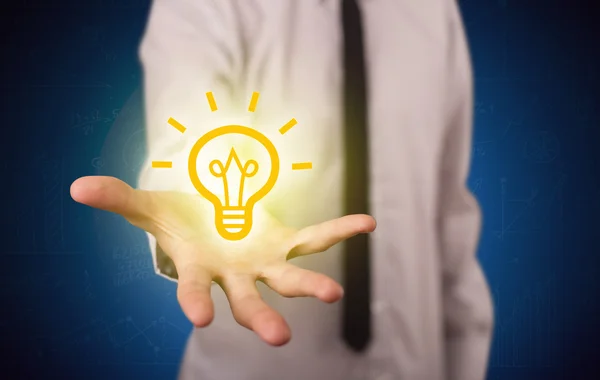 Sales guy has bright idea in the hand — Stock Photo, Image