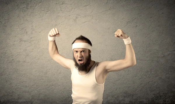 Young male showing muscles — Stock Photo, Image