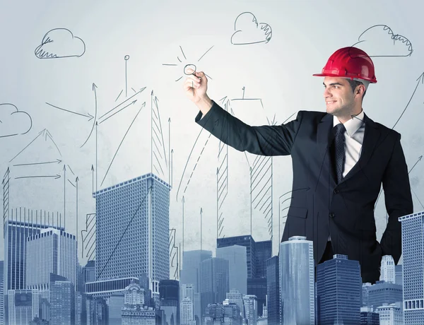 Joven trabajador dibujando una ciudad vista — Foto de Stock