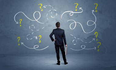 Unsure businessman with question marks clipart