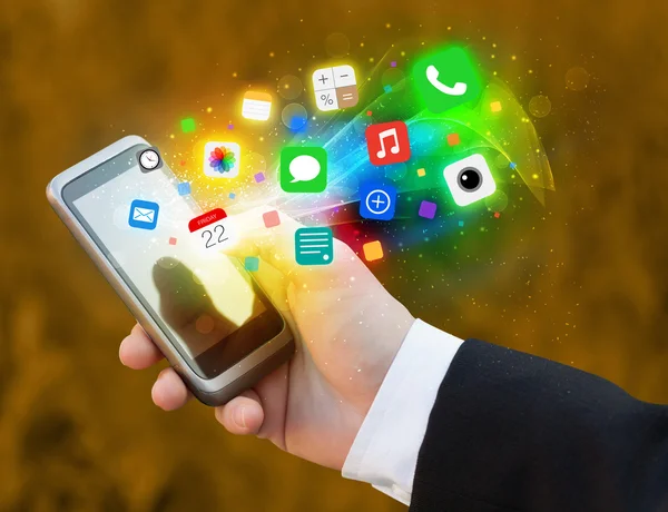 Hand holding smartphone with colorful app icons — Stock Photo, Image