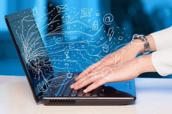Man pressing notebook laptop computer with doodle icon cloud sym — Stock Photo, Image