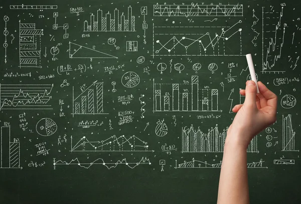 A business person drawing data on chalkboard — Stock Photo, Image