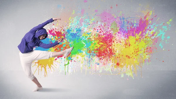 Young colorful street dancer with paint splash — Stock Photo, Image