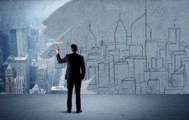 Zarif satıcı şehri duvarda yeniden boyuyor.