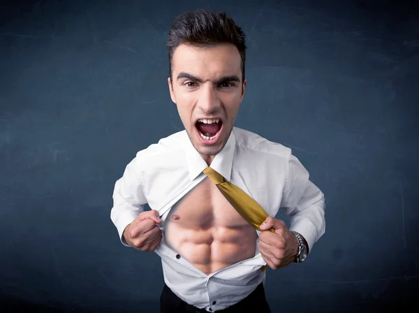 Businessman tearing off shirt and showing mucular body — Stock Photo, Image