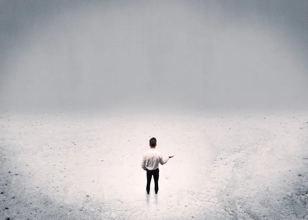 Businessman standing in urban empty space — Stock Photo, Image