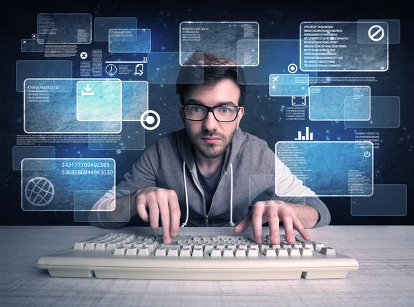 Nerd with glasses hacking websites — Stock Photo, Image