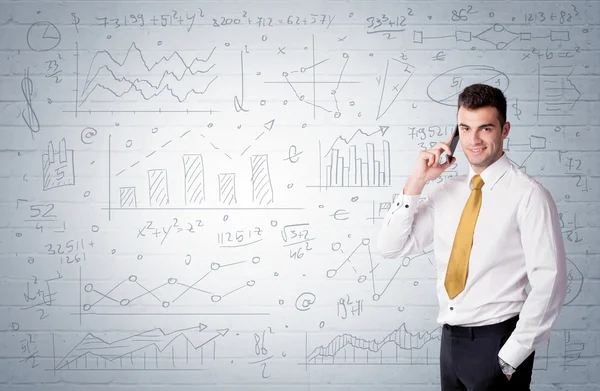 Salesman standing with drawn graph charts — Stock Photo, Image