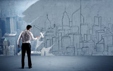 Zarif satıcı şehri duvarda yeniden boyuyor.