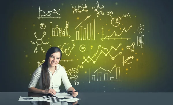 Businesswoman with business diagrams — Stock Photo, Image