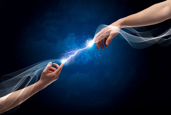 Hands connecting through fingers in space