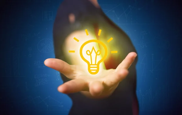 Sales guy has bright idea in the hand — Stock Photo, Image