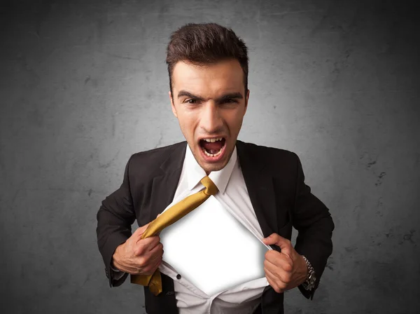 Businessman tearing off his shirt with white copyspace on chest — Stock Photo, Image