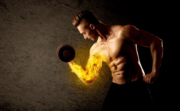 Muscular bodybuilder lifting weight with flaming biceps concept — Stock Photo, Image