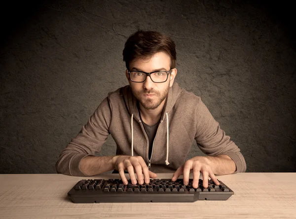 Computer geek typing on keyboard — Stock Photo, Image