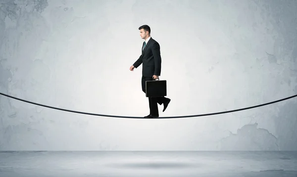 Sales guy balancing on tight rope — Stock Photo, Image